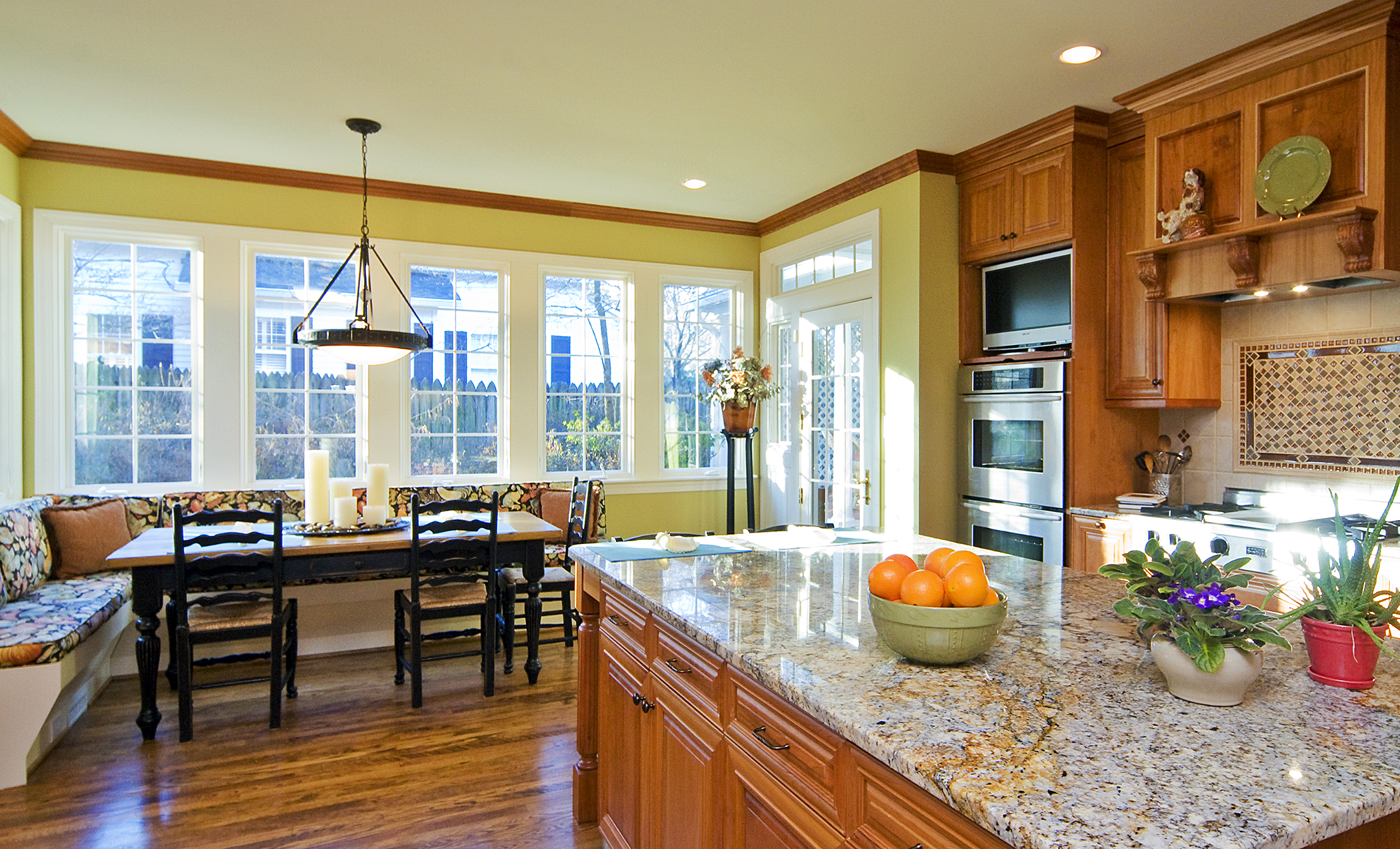 A bank of windows adds much to this remodeled kitchen