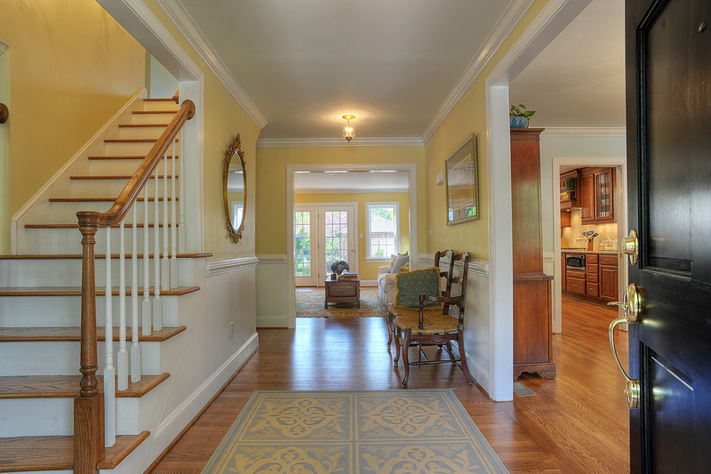After renovations, a stairway was created and openings to the dining room and family room were widened
